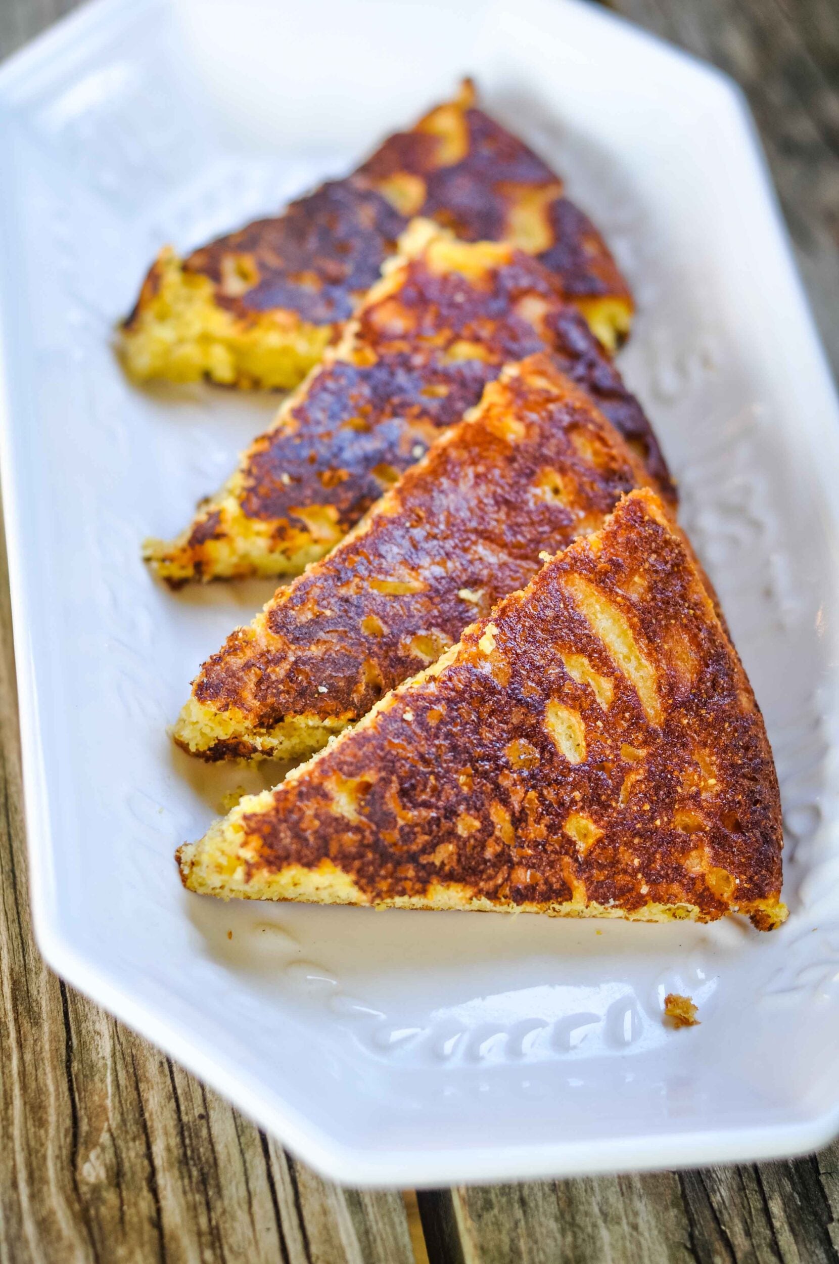 Soft and fluffy 100 year old Southern cornbread recipe served on a platter.